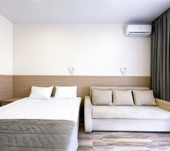 Корпус Андорра Стандарт с Раскладным Двуспальным Диваном в Family Pride Inn Прайд