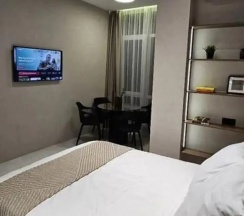 Четырёхместные апартаменты c 1 комнатой с балконом и с видом на море в Квартира Дизайнерская двухуровневая с видом на море