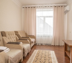 Двухкомнатный номер с одной большой  кроватью в Великий Каспий