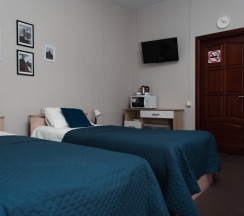 Двухместная комната с 2 односпальными кроватями и общей ванной комнатой в МК Мокко