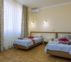 Номер стандарт с 2 односпальными кроватями без балкона в ТриО