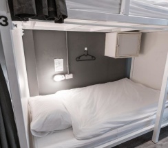 Кровать в общем номере в The Cocoon Hostel