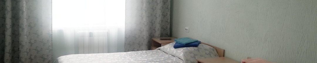 Кровать в 2-местном общем номере в Уютная