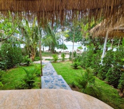 Двухместное бунгало Superior рядом с пляжем двуспальная кровать в Secret Beach Bungalows